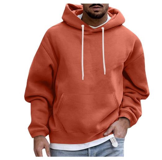 Orange hoodie worn by a person on a white background
