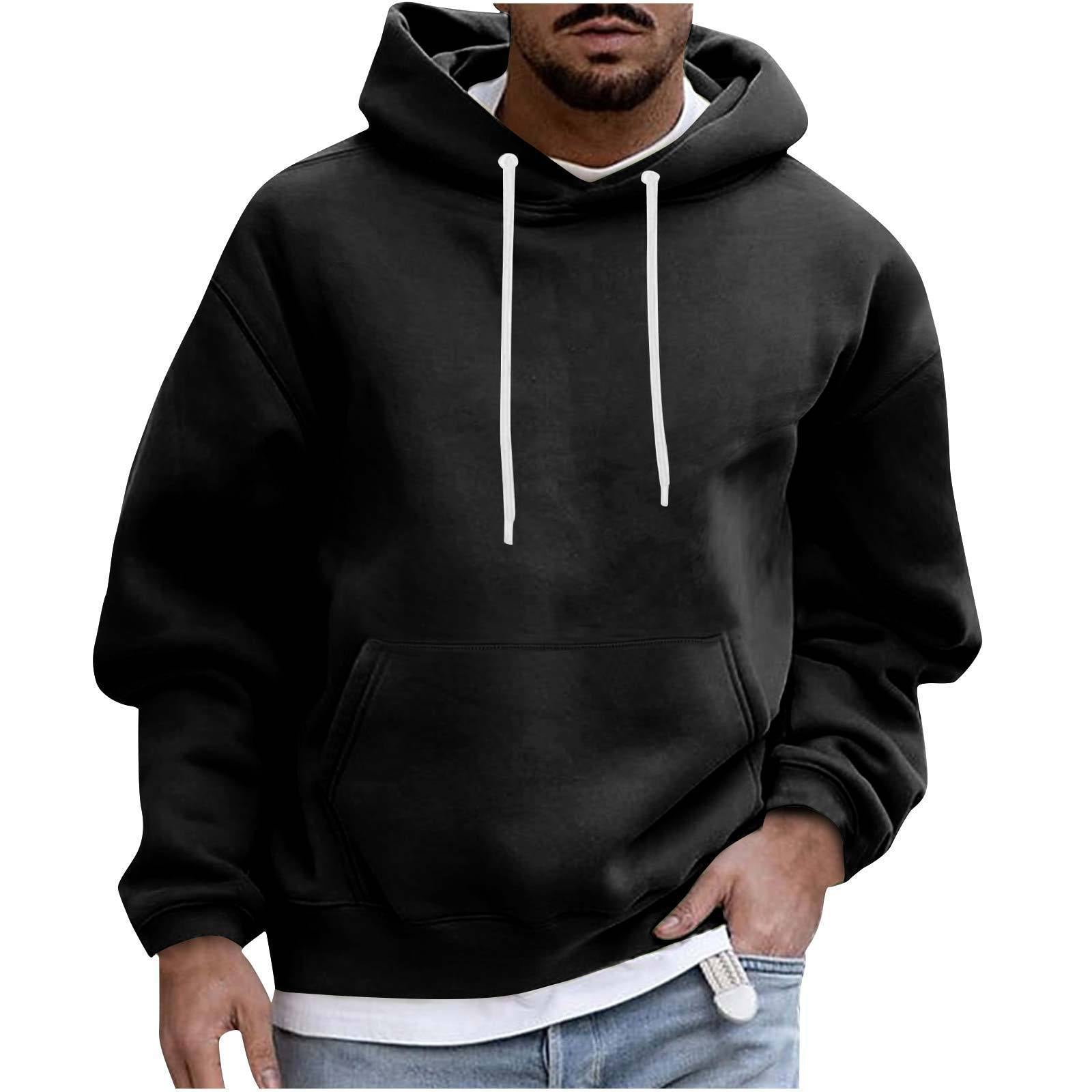 Black hoodie worn by a person on a white background